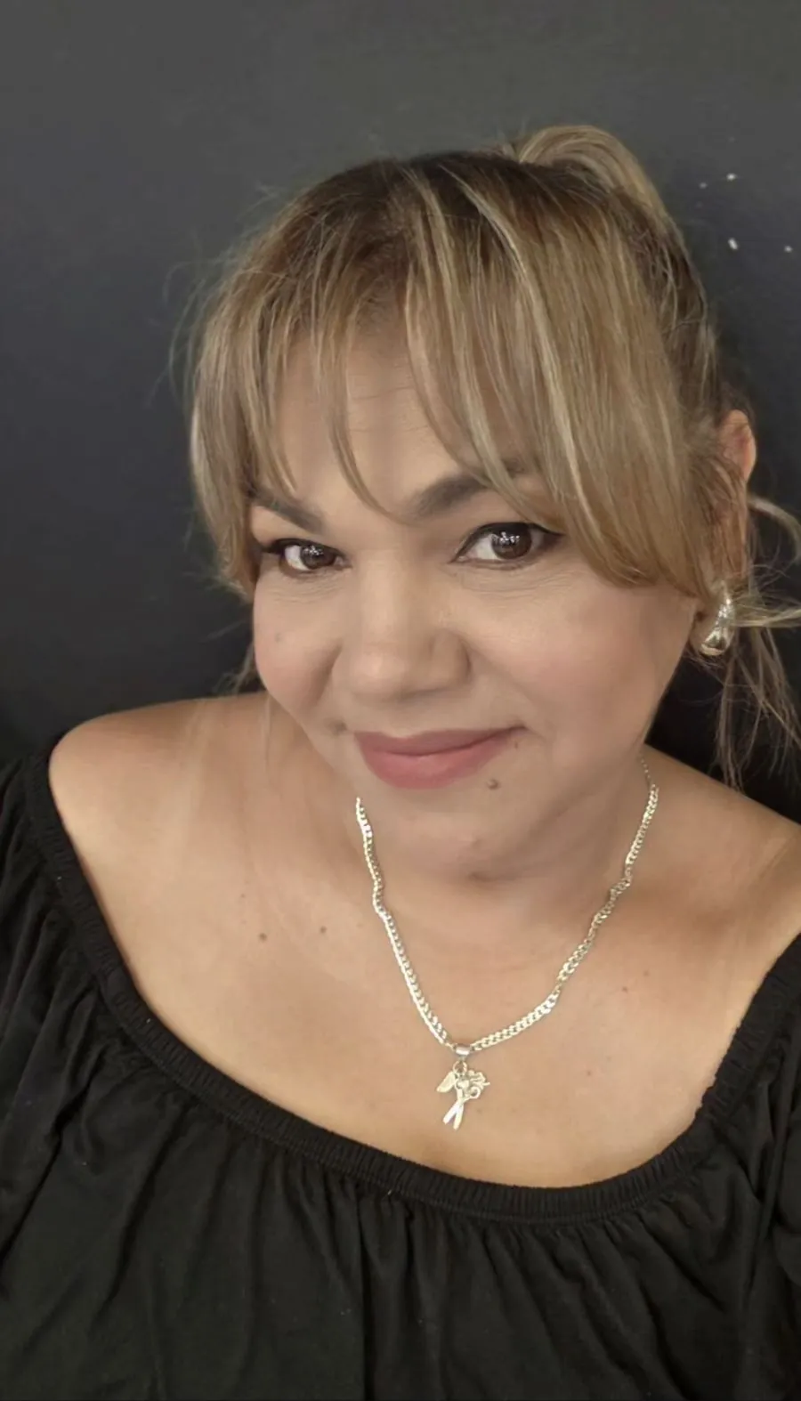 Doris, owner and stylist of DELY Hair Studio